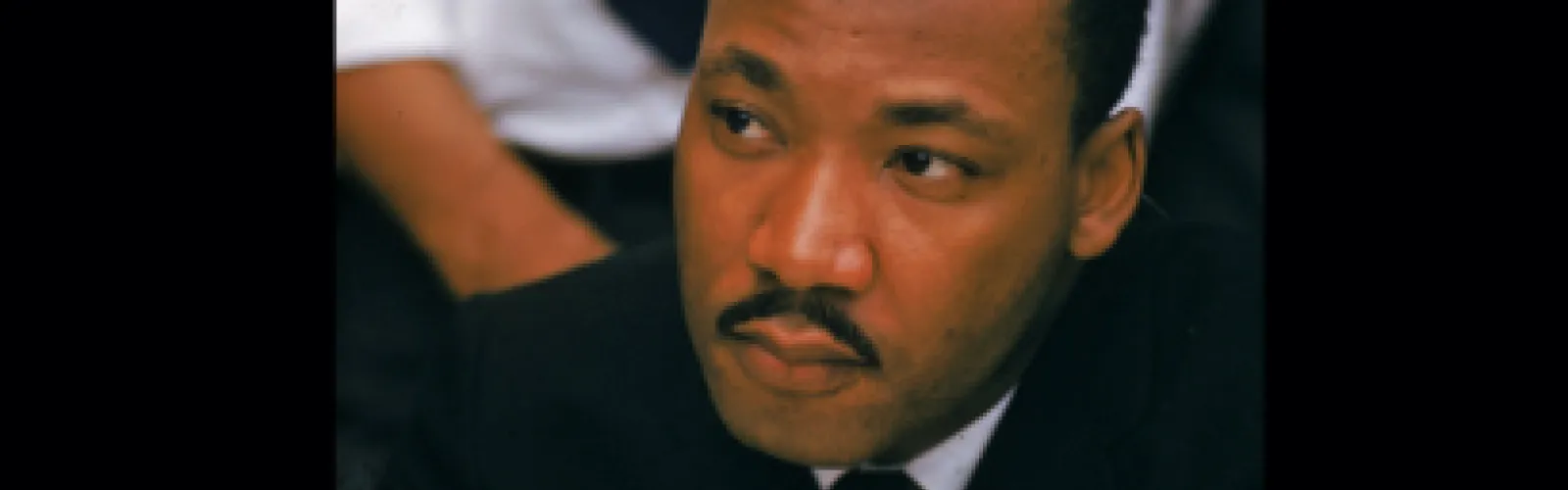 A headshot of Martin Luther King, Jr. looking to his right